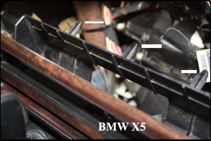 BMW X5 - Shows Center Console Prongs Fitted Through Dash Holes.