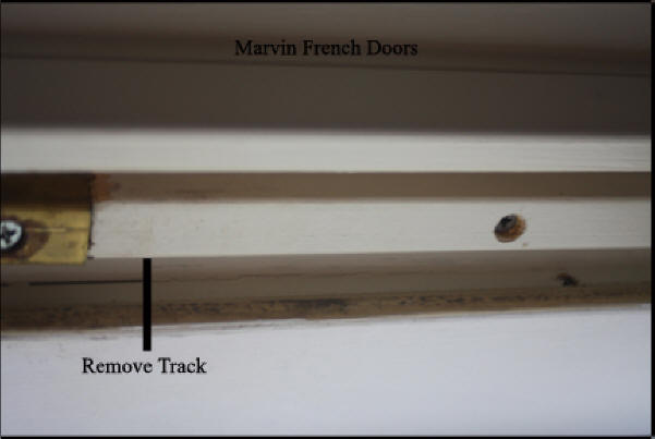 Marvin wood French doors - Shows track at top of wood frame that must be removed to allow door to be removed