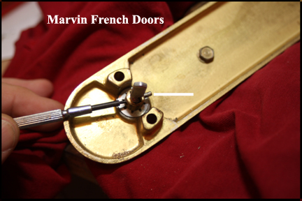 Marvin wood French Doors - Shows driving the holding the pin that is holding the actuator in the locking knob