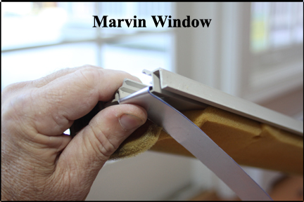 Marvin Wood Double Hung Windows - Shows Aluminum Strip Being Fitted Into and Over Broken Vinyl Track