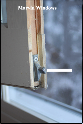 Marvin wood double hung window - Shows metal slide at bottom of window