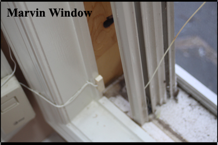 Marvin Wood Double Hung Windows - Shows aligning bottom of vinyl track with windowsill