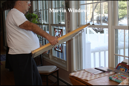 Marvin Wood Double Hung Windows - Lifting window out of vinyl track and wood frame.