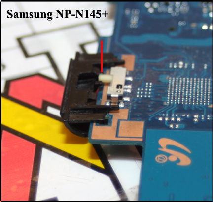Samsung NP-N145+ showing how slide switch cover sits on edge of motherboard and goes over electrical, motherboard mounted, slide switch.