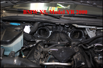 BMW X5 - Shows cabin air intake shroud romoved from firewall.