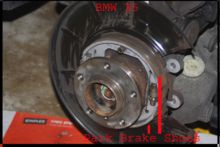 BMW X5 - Shows rotor off rear hub and location of park brake shoes.
