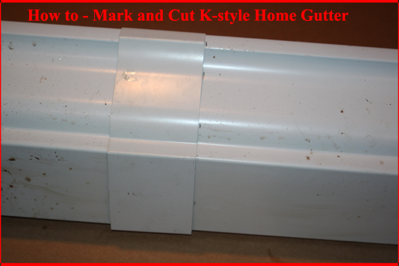 K-style gutter joiner placed over marked roof gutter to allow cut line to be drawn.