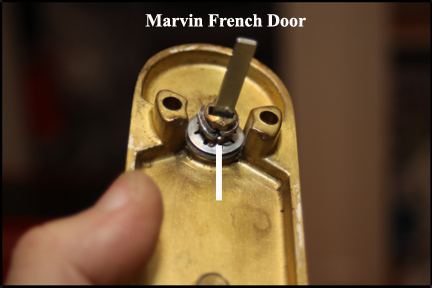 Marvin wood French doors - Shows cotter pins bent around locking knob, holding new actuator pin in place