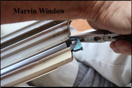 Marvin Wood Double Hung Windows - Shows Aligning Sash Tube Window Catch into Vinyl Track