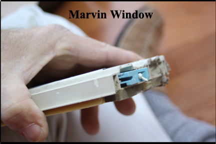 Marvin Wood Double Hung Windows - Shows Sash Tube Window Catch Properly Inserted into Vinyl Track
