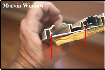 Marvin Wood Double Hung Windows - Shows Ridge in Vinyl Track that Sash Tube Window Catch Must Fit Into.