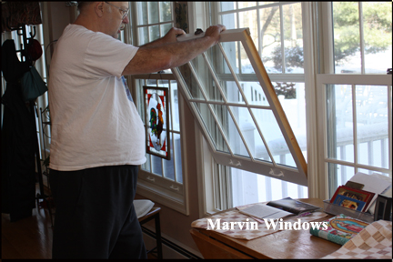 Marvin Wood Double Hung Windows - Shows pushing top of window towards frame to get window to latch into vinyl track at top