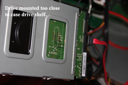 Shows situation where hard drive mounted too close to chassis base to add hard drive fan